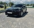 Черный Мицубиси Лансер, объемом двигателя 2 л и пробегом 211 тыс. км за 6200 $, фото 1 на Automoto.ua