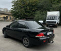 Чорний Міцубісі Lancer, об'ємом двигуна 1.58 л та пробігом 256 тис. км за 4200 $, фото 4 на Automoto.ua
