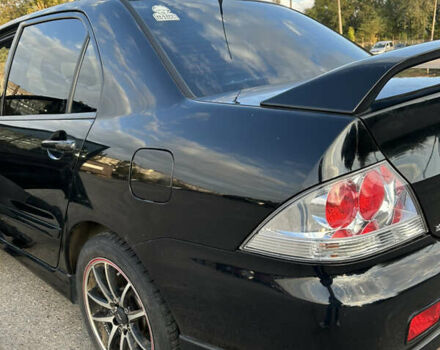 Чорний Міцубісі Lancer, об'ємом двигуна 2 л та пробігом 280 тис. км за 4600 $, фото 24 на Automoto.ua