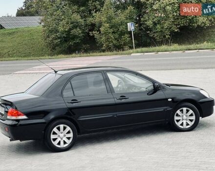 Чорний Міцубісі Lancer, об'ємом двигуна 1.6 л та пробігом 243 тис. км за 4950 $, фото 29 на Automoto.ua