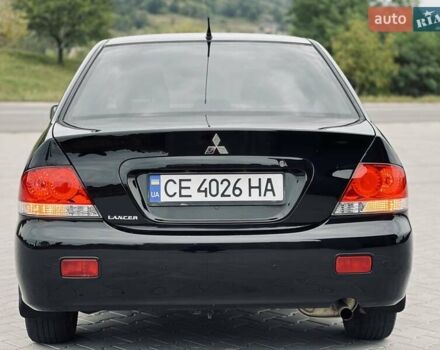Чорний Міцубісі Lancer, об'ємом двигуна 1.6 л та пробігом 243 тис. км за 4950 $, фото 24 на Automoto.ua