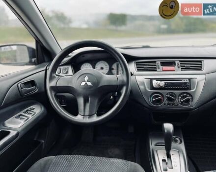 Чорний Міцубісі Lancer, об'ємом двигуна 1.6 л та пробігом 243 тис. км за 4950 $, фото 51 на Automoto.ua