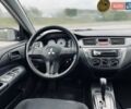 Чорний Міцубісі Lancer, об'ємом двигуна 1.6 л та пробігом 243 тис. км за 4950 $, фото 51 на Automoto.ua
