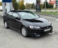 Черный Мицубиси Лансер, объемом двигателя 2 л и пробегом 250 тыс. км за 4850 $, фото 1 на Automoto.ua