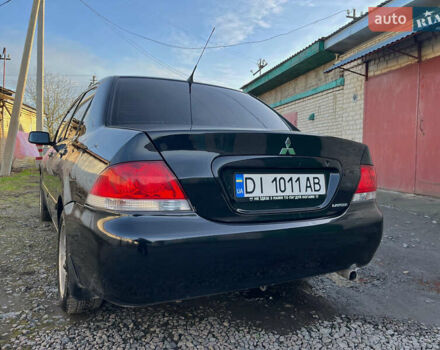 Черный Мицубиси Лансер, объемом двигателя 1.58 л и пробегом 156 тыс. км за 4599 $, фото 8 на Automoto.ua