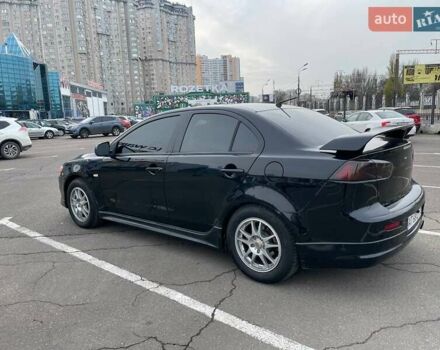 Черный Мицубиси Лансер, объемом двигателя 2 л и пробегом 246 тыс. км за 7500 $, фото 2 на Automoto.ua