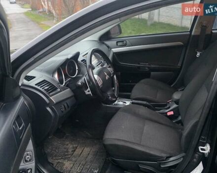 Черный Мицубиси Лансер, объемом двигателя 2 л и пробегом 116 тыс. км за 7200 $, фото 6 на Automoto.ua