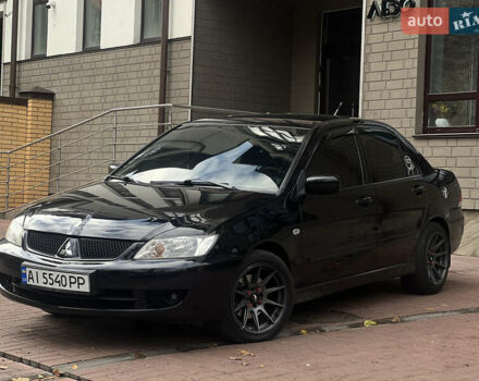 Черный Мицубиси Лансер, объемом двигателя 1.6 л и пробегом 211 тыс. км за 5700 $, фото 5 на Automoto.ua