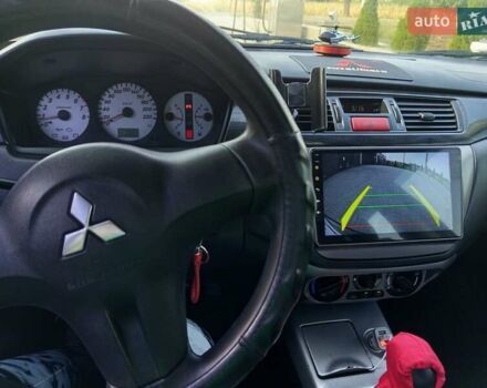 Черный Мицубиси Лансер, объемом двигателя 1.6 л и пробегом 320 тыс. км за 4500 $, фото 9 на Automoto.ua