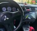 Черный Мицубиси Лансер, объемом двигателя 1.6 л и пробегом 320 тыс. км за 4500 $, фото 9 на Automoto.ua