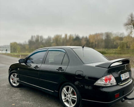 Черный Мицубиси Лансер, объемом двигателя 2 л и пробегом 260 тыс. км за 5300 $, фото 5 на Automoto.ua