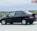 Черный Мицубиси Лансер, объемом двигателя 1.58 л и пробегом 243 тыс. км за 4950 $, фото 5 на Automoto.ua