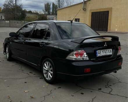 Чорний Міцубісі Lancer, об'ємом двигуна 2 л та пробігом 143 тис. км за 5400 $, фото 2 на Automoto.ua