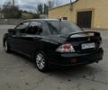 Чорний Міцубісі Lancer, об'ємом двигуна 2 л та пробігом 143 тис. км за 5400 $, фото 2 на Automoto.ua