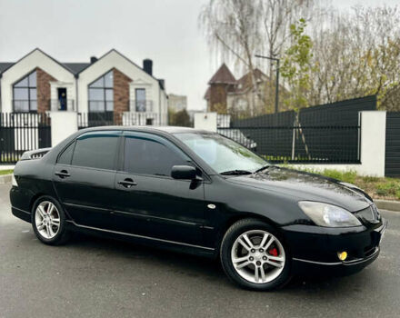 Черный Мицубиси Лансер, объемом двигателя 2 л и пробегом 260 тыс. км за 5300 $, фото 2 на Automoto.ua