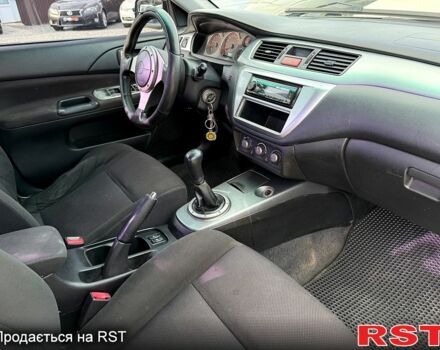 Черный Мицубиси Лансер, объемом двигателя 1.6 л и пробегом 260 тыс. км за 3700 $, фото 8 на Automoto.ua