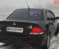 Черный Мицубиси Лансер, объемом двигателя 1.6 л и пробегом 230 тыс. км за 4700 $, фото 1 на Automoto.ua
