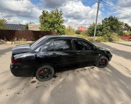 Черный Мицубиси Лансер, объемом двигателя 1.6 л и пробегом 244 тыс. км за 4100 $, фото 3 на Automoto.ua