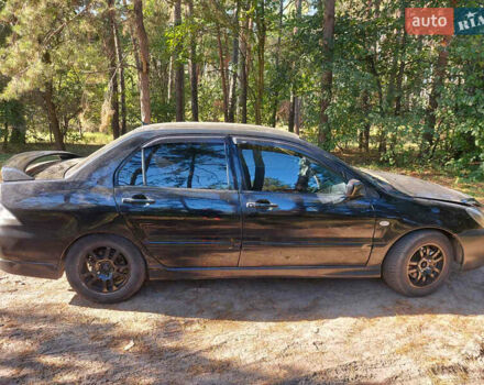 Чорний Міцубісі Lancer, об'ємом двигуна 2 л та пробігом 290 тис. км за 3300 $, фото 5 на Automoto.ua