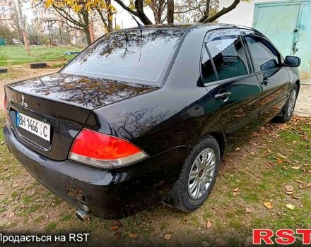 Чорний Міцубісі Lancer, об'ємом двигуна 1.6 л та пробігом 227 тис. км за 4100 $, фото 4 на Automoto.ua