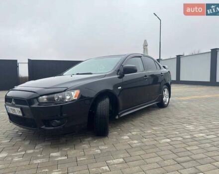 Черный Мицубиси Лансер, объемом двигателя 2 л и пробегом 259 тыс. км за 6500 $, фото 4 на Automoto.ua