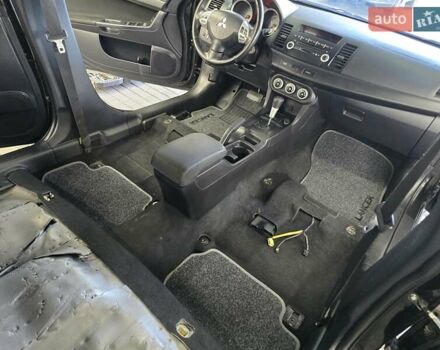 Чорний Міцубісі Lancer, об'ємом двигуна 2 л та пробігом 260 тис. км за 6555 $, фото 48 на Automoto.ua