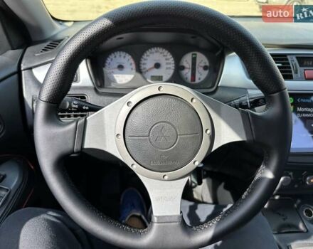 Черный Мицубиси Лансер, объемом двигателя 2 л и пробегом 272 тыс. км за 5514 $, фото 6 на Automoto.ua