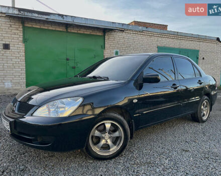 Черный Мицубиси Лансер, объемом двигателя 1.58 л и пробегом 156 тыс. км за 4599 $, фото 3 на Automoto.ua