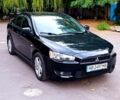 Черный Мицубиси Лансер, объемом двигателя 2 л и пробегом 210 тыс. км за 6500 $, фото 1 на Automoto.ua