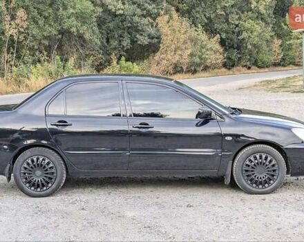 Черный Мицубиси Лансер, объемом двигателя 1.6 л и пробегом 226 тыс. км за 4800 $, фото 3 на Automoto.ua