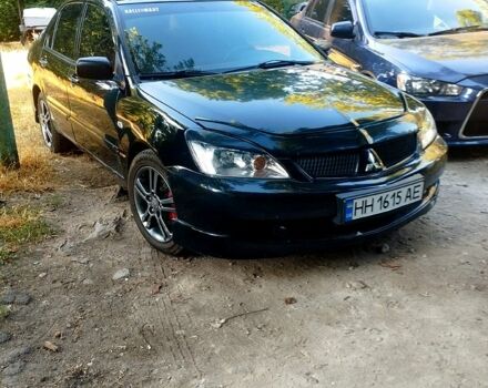 Черный Мицубиси Лансер, объемом двигателя 2 л и пробегом 168 тыс. км за 3800 $, фото 3 на Automoto.ua