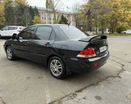 Черный Мицубиси Лансер, объемом двигателя 1.6 л и пробегом 173 тыс. км за 4700 $, фото 2 на Automoto.ua