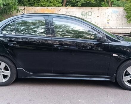 Черный Мицубиси Лансер, объемом двигателя 2 л и пробегом 210 тыс. км за 6000 $, фото 4 на Automoto.ua