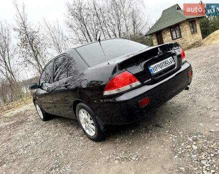 Черный Мицубиси Лансер, объемом двигателя 1.6 л и пробегом 216 тыс. км за 4990 $, фото 2 на Automoto.ua