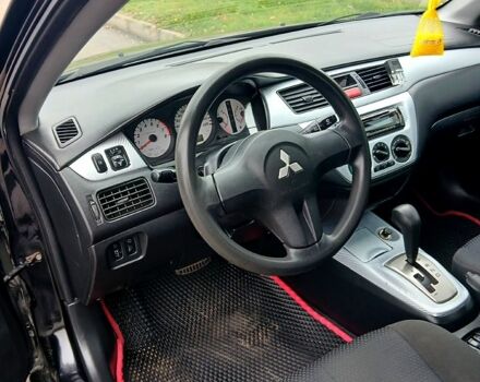 Чорний Міцубісі Lancer, об'ємом двигуна 1.6 л та пробігом 240 тис. км за 4700 $, фото 4 на Automoto.ua