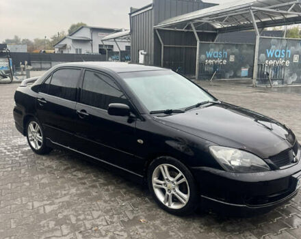 Чорний Міцубісі Lancer, об'ємом двигуна 2 л та пробігом 210 тис. км за 5500 $, фото 5 на Automoto.ua