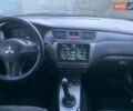 Черный Мицубиси Лансер, объемом двигателя 1.58 л и пробегом 237 тыс. км за 3999 $, фото 4 на Automoto.ua