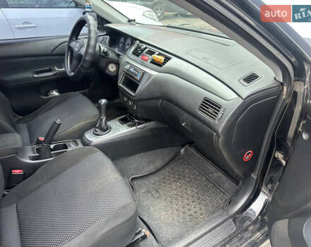 Черный Мицубиси Лансер, объемом двигателя 1.58 л и пробегом 290 тыс. км за 3000 $, фото 12 на Automoto.ua