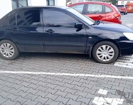 Черный Мицубиси Лансер, объемом двигателя 1.6 л и пробегом 223 тыс. км за 4300 $, фото 2 на Automoto.ua