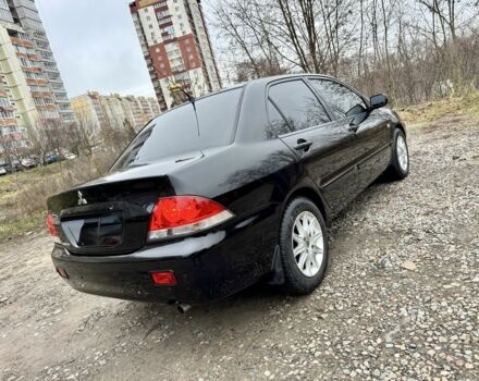 Чорний Міцубісі Lancer, об'ємом двигуна 1.6 л та пробігом 216 тис. км за 4990 $, фото 4 на Automoto.ua