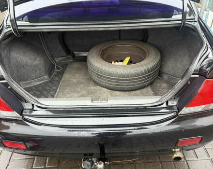 Чорний Міцубісі Lancer, об'ємом двигуна 1.58 л та пробігом 256 тис. км за 3700 $, фото 10 на Automoto.ua