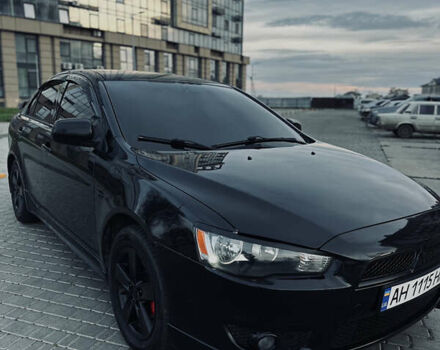 Черный Мицубиси Лансер, объемом двигателя 2 л и пробегом 245 тыс. км за 6200 $, фото 5 на Automoto.ua