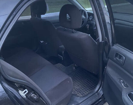 Черный Мицубиси Лансер, объемом двигателя 1.58 л и пробегом 213 тыс. км за 4900 $, фото 6 на Automoto.ua