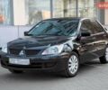 Черный Мицубиси Лансер, объемом двигателя 1.6 л и пробегом 175 тыс. км за 5300 $, фото 1 на Automoto.ua