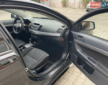 Черный Мицубиси Лансер, объемом двигателя 2 л и пробегом 200 тыс. км за 6199 $, фото 9 на Automoto.ua