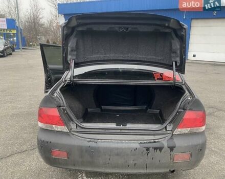 Черный Мицубиси Лансер, объемом двигателя 1.58 л и пробегом 263 тыс. км за 4000 $, фото 5 на Automoto.ua