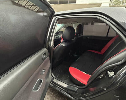 Черный Мицубиси Лансер, объемом двигателя 1.58 л и пробегом 254 тыс. км за 5000 $, фото 16 на Automoto.ua