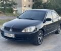 Черный Мицубиси Лансер, объемом двигателя 1.6 л и пробегом 214 тыс. км за 4489 $, фото 1 на Automoto.ua