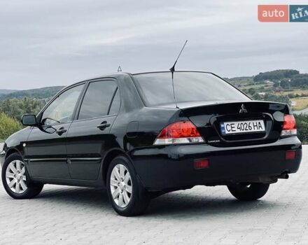 Чорний Міцубісі Lancer, об'ємом двигуна 1.6 л та пробігом 243 тис. км за 4950 $, фото 26 на Automoto.ua