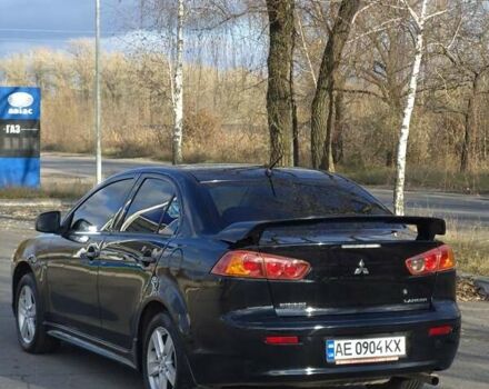 Черный Мицубиси Лансер, объемом двигателя 2 л и пробегом 224 тыс. км за 7000 $, фото 2 на Automoto.ua